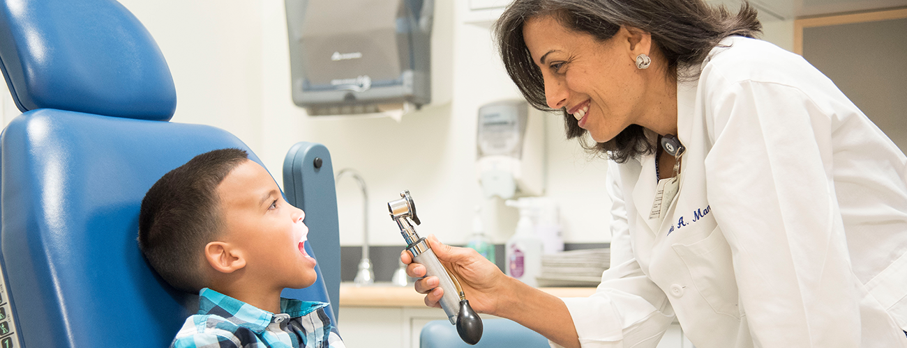Mass Eye and Ear doctor examining a pediatric patient