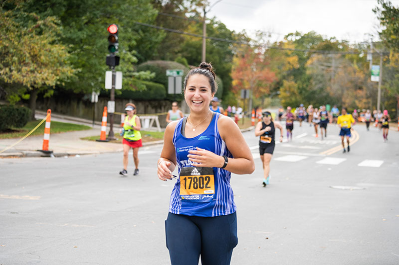 Member of Team Eye and Ear running at Boston Marathon