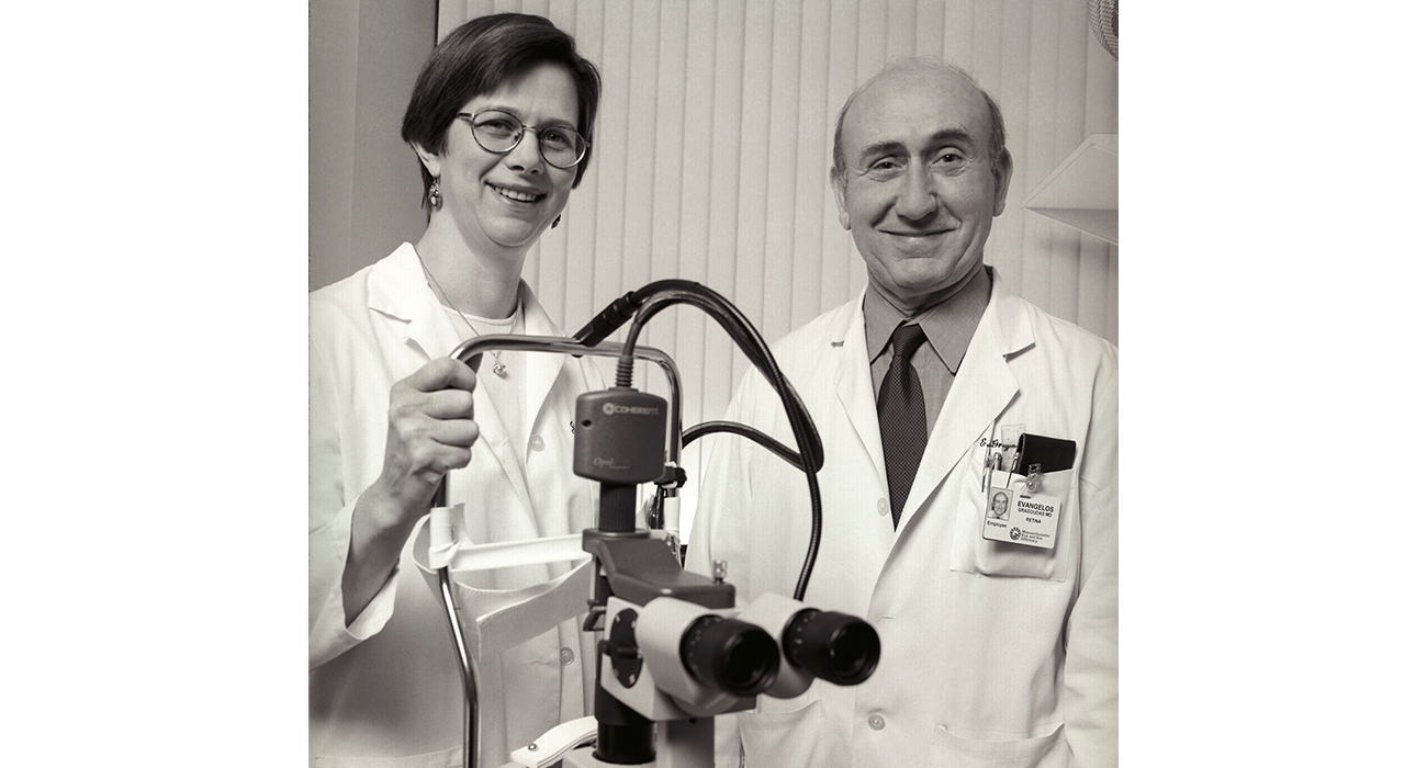 black and white photo of Joan Miller and Evangelos Gragoudas with PDT laser 